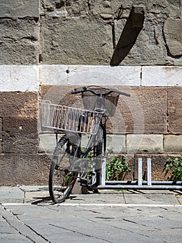 Old bicycle in Lucca, Italy photo